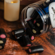 Load image into Gallery viewer, Liquorice creams spilling onto a table
