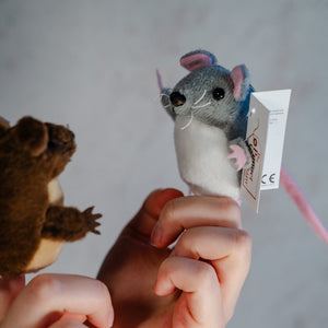 grey mouse puppet talking to brown finger puppet 