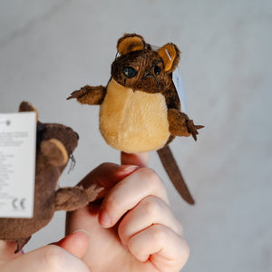 Two brown mouse finger puppets interacting