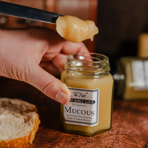 A knife and open jar of Dr Arnott's "Mucous" (Pure Flower Honey) at The Real Mary King's Close 