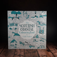 Load image into Gallery viewer, The Scottish Coastal Colouring Book displayed on a wood panelled desk
