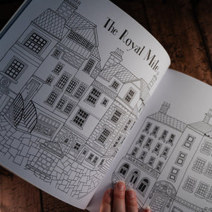 Line drawing of the Royal Mile for colouring in as displayed in an open book