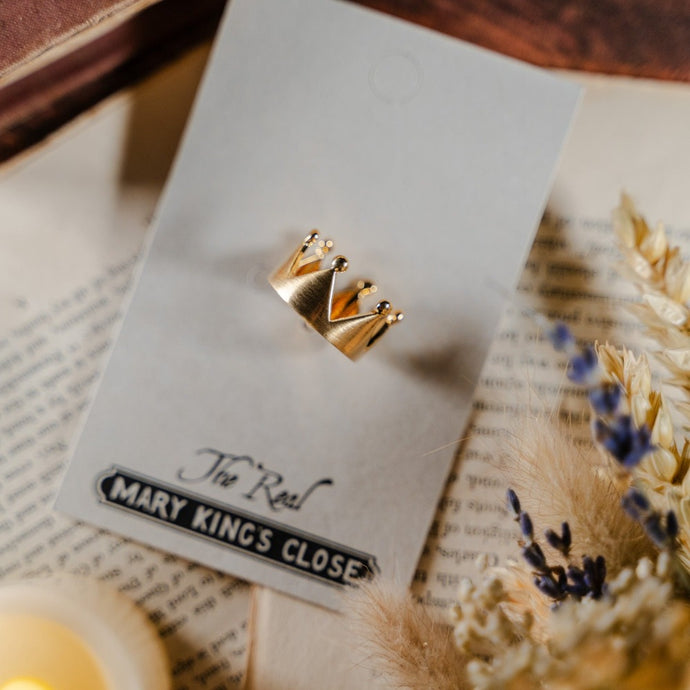 Simple golden crown finger ring in its The Real Mary King's Close packaging