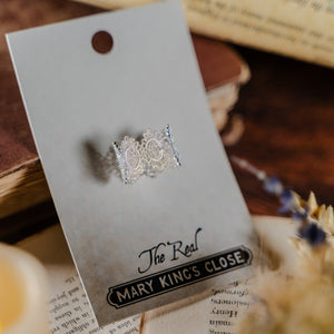 Silver crown ring in its The Real Mary King's Close packaging 