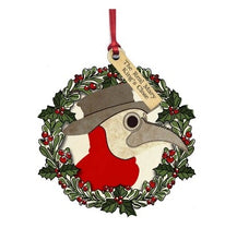 Load image into Gallery viewer, plague doctor mask painted on wooden wreath decoration, labelled with a message reading &quot;the real mary king&#39;s close&quot;
